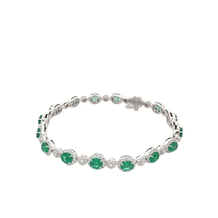 Bracelet- emerald straight line style with diamond halos 18kt white gold
