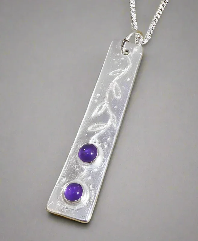 Jane Vernon Fine silver long thin pendant set with two amethyst cabochons A40