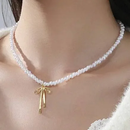 Pearl Necklace with Coquette Bow Pendant in Gold Finish 16″ Long