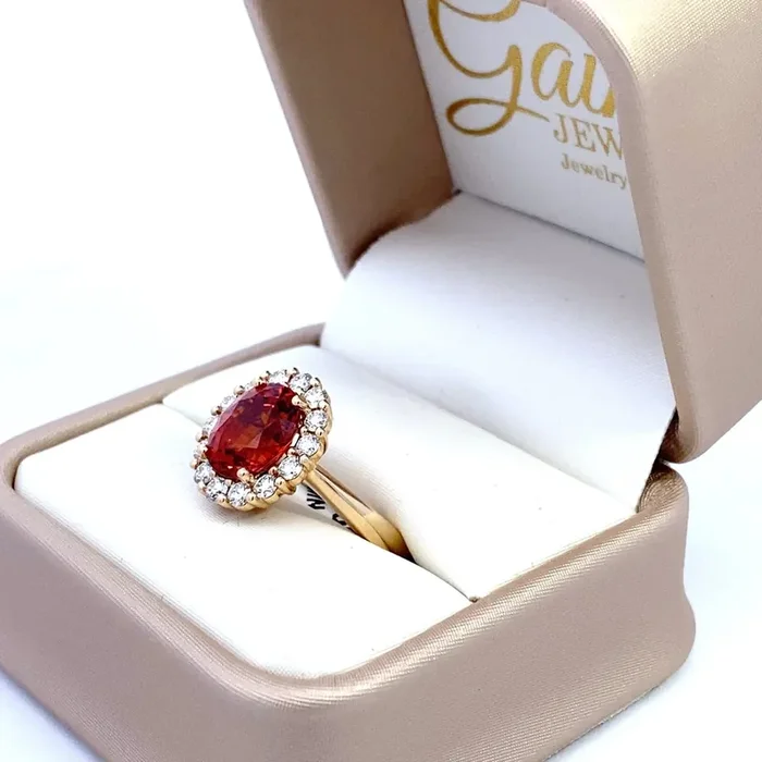 Ring set with a mandarin garnet surrounded by diamonds 14kt yellow gold by Rego