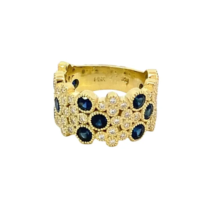 Ring wide band style randomly set with sapphires and pave‘d with diamonds 14kt yellow gold