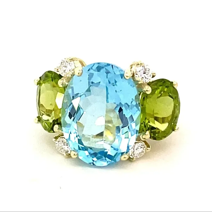 Ring with sky blue topaz peridot and diamonds 14kt yellow gold